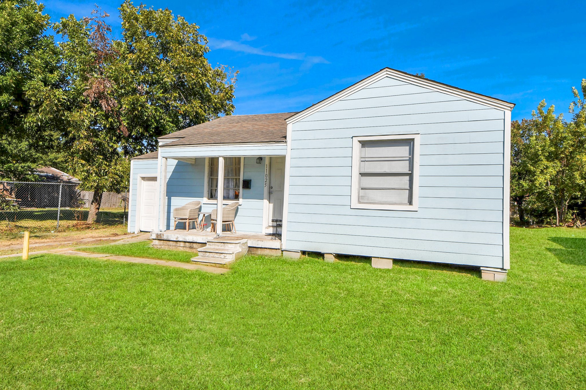 11025 Muscatine Street Houston, TX 77029 - Photo 25 of 33 a front view of a house with a yard and porch