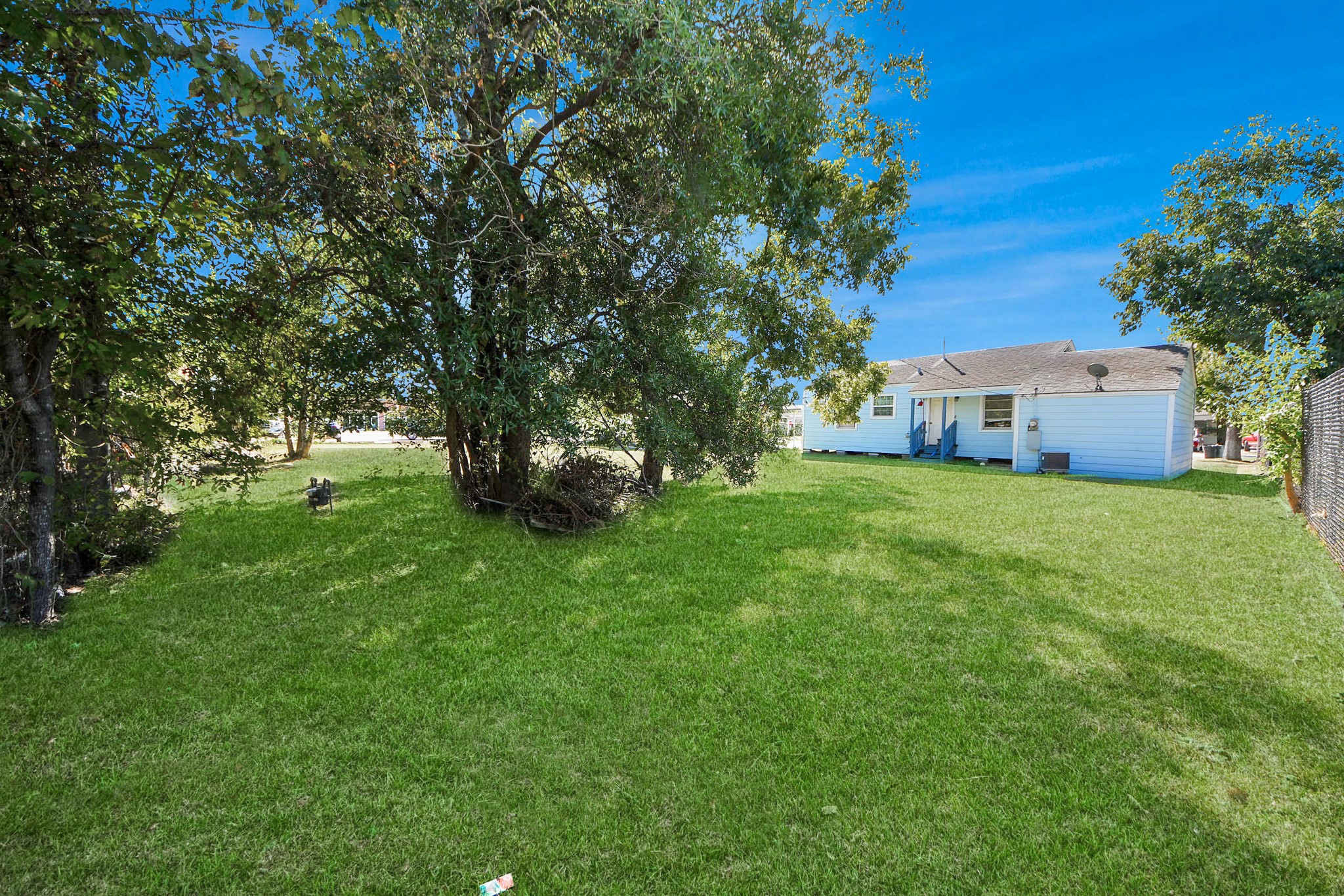 11025 Muscatine Street Houston, TX 77029 - Photo 28 of 33 a view of a house with a big yard
