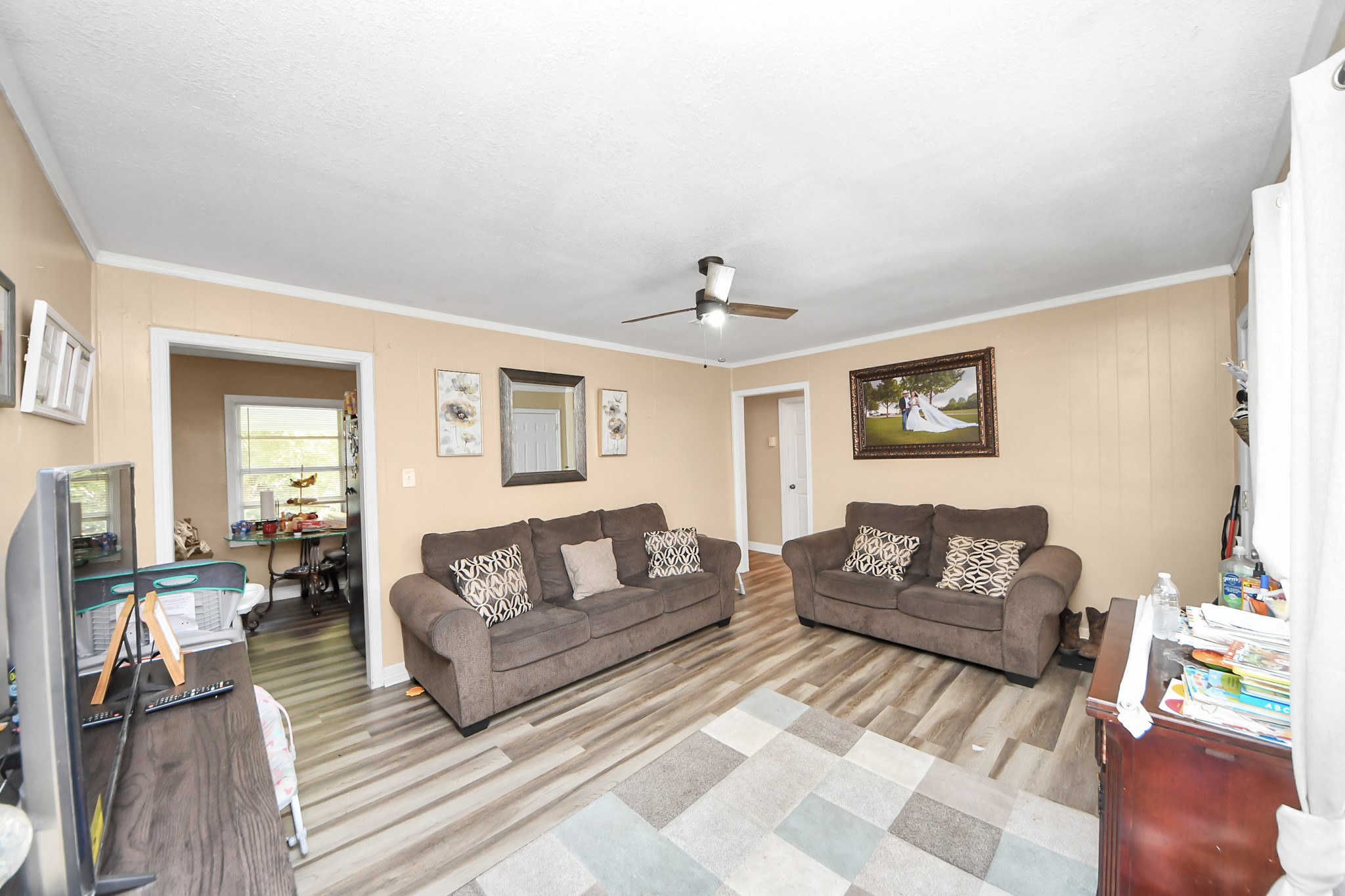 11025 Muscatine Street Houston, TX 77029 - Photo 4 of 33 a living room with furniture and a wooden floor