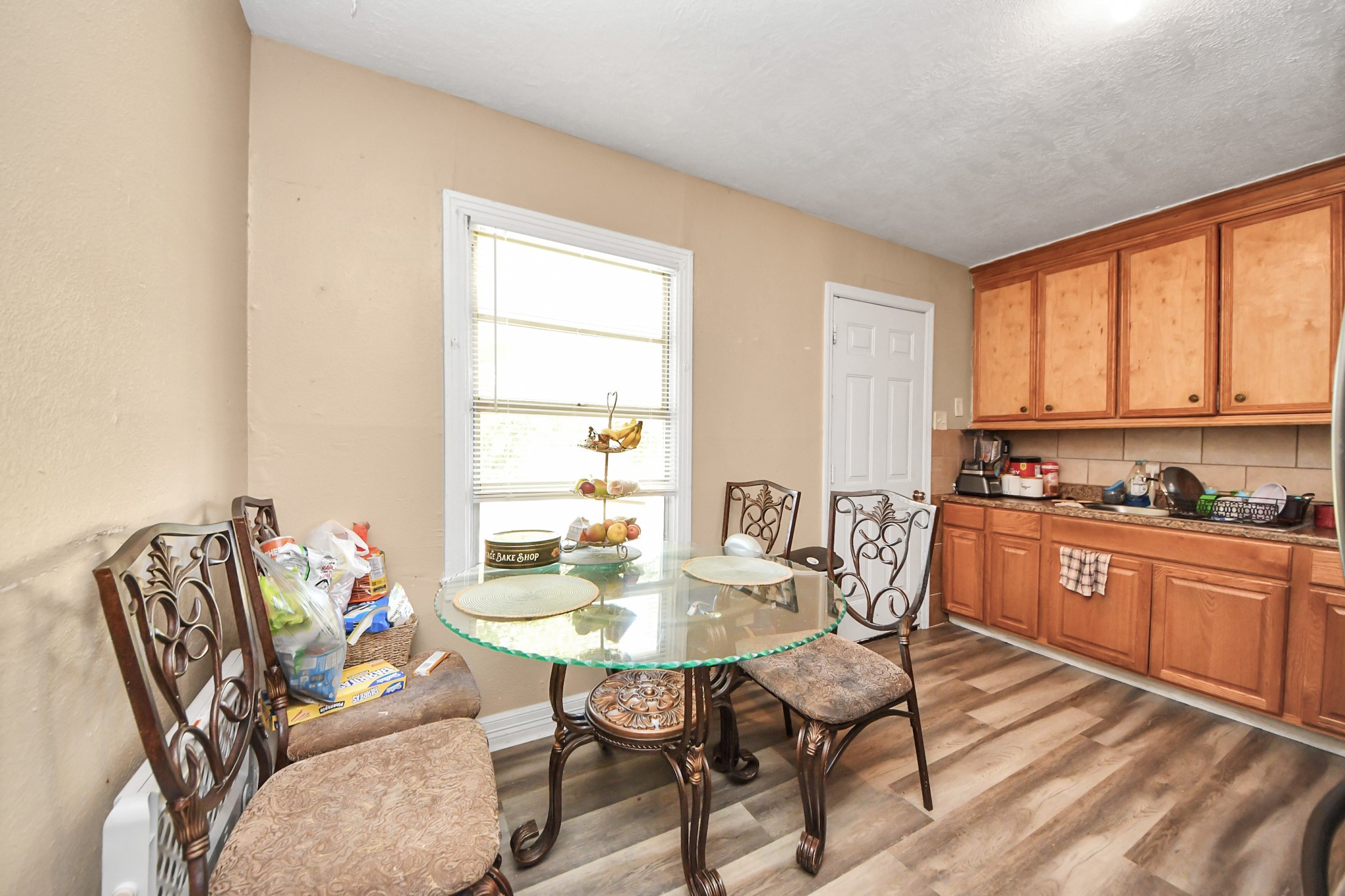 11025 Muscatine Street Houston, TX 77029 - Photo 6 of 33 a view of a dining room with furniture and window