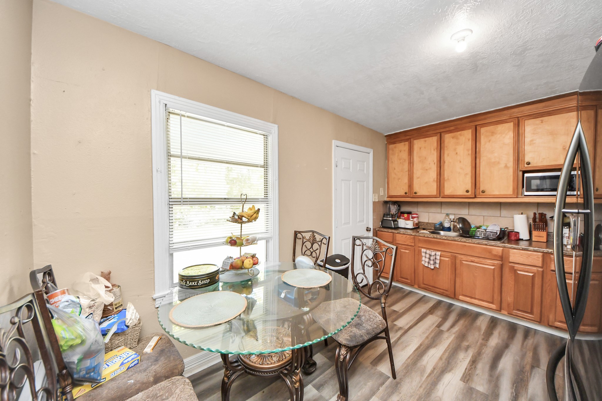 11025 Muscatine Street Houston, TX 77029 - Photo 7 of 33 a view of a dining room with furniture window and outside view