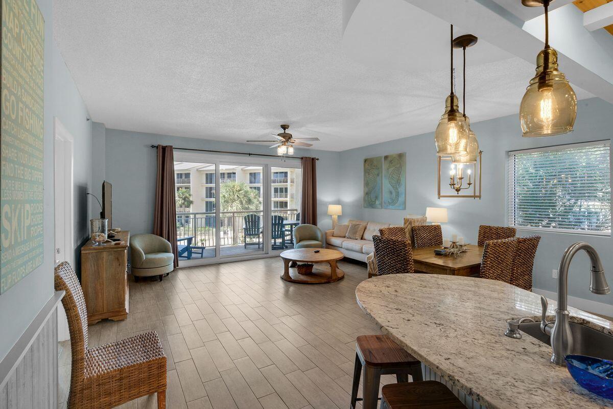 10254 East County Road, Unit 315 Inlet Beach, FL 32461 - Photo 11 of 37 a living room with furniture fireplace and large windows
