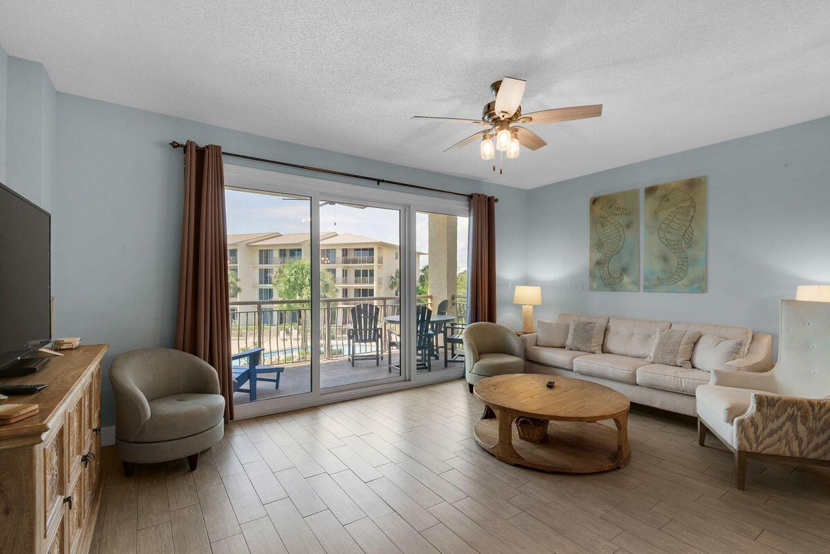 10254 East County Road, Unit 315 Inlet Beach, FL 32461 - Photo 12 of 37 a living room with furniture and a large window