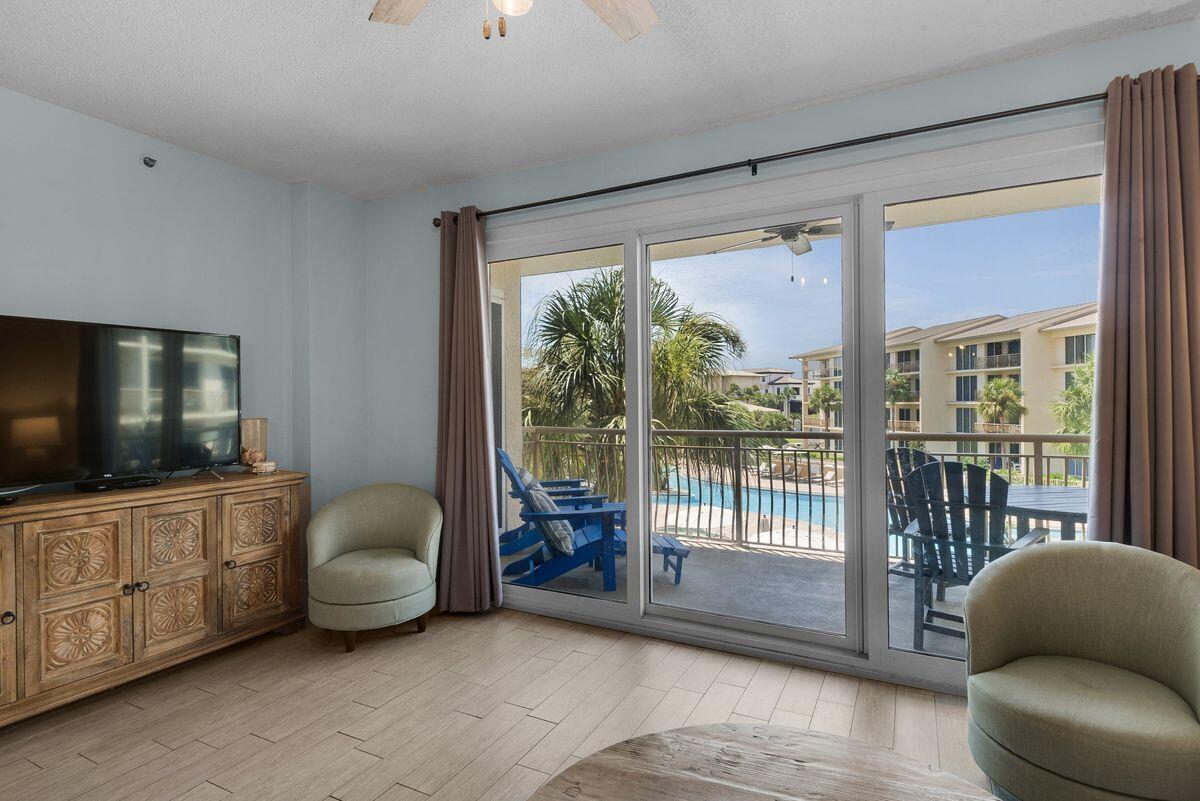 10254 East County Road, Unit 315 Inlet Beach, FL 32461 - Photo 13 of 37 a living room with furniture and a flat screen tv