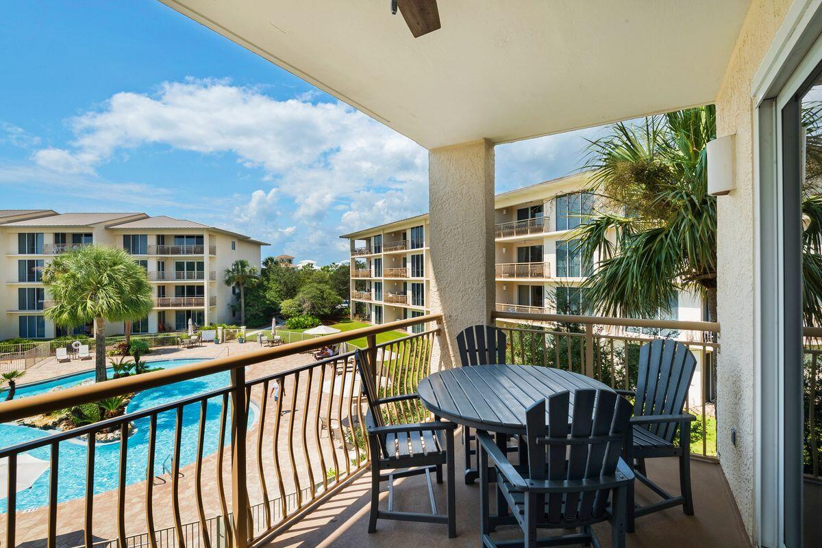 10254 East County Road, Unit 315 Inlet Beach, FL 32461 - Photo 16 of 37 a view of a chair and table in the balcony