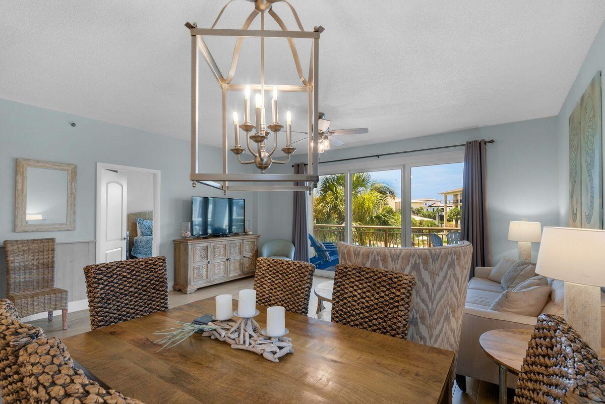 10254 East County Road, Unit 315 Inlet Beach, FL 32461 - Photo 17 of 37 a living room with furniture and a chandelier