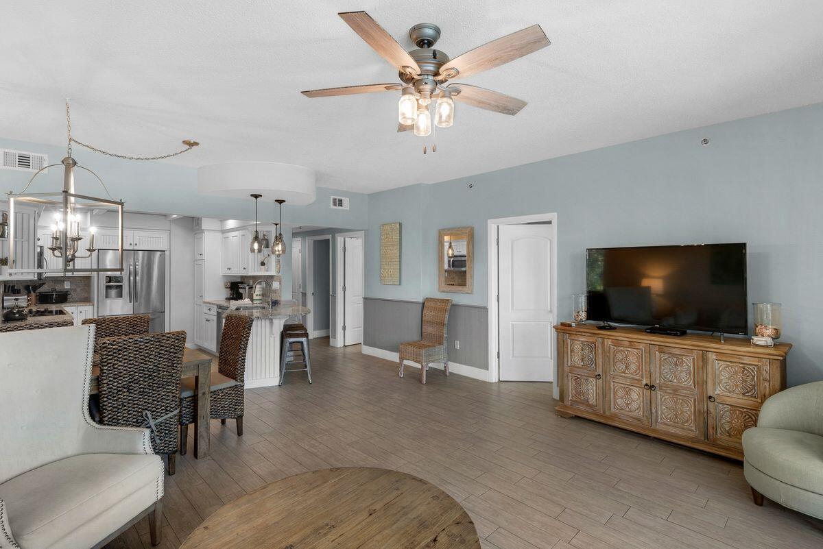 10254 East County Road, Unit 315 Inlet Beach, FL 32461 - Photo 18 of 37 a living room with furniture and a flat screen tv