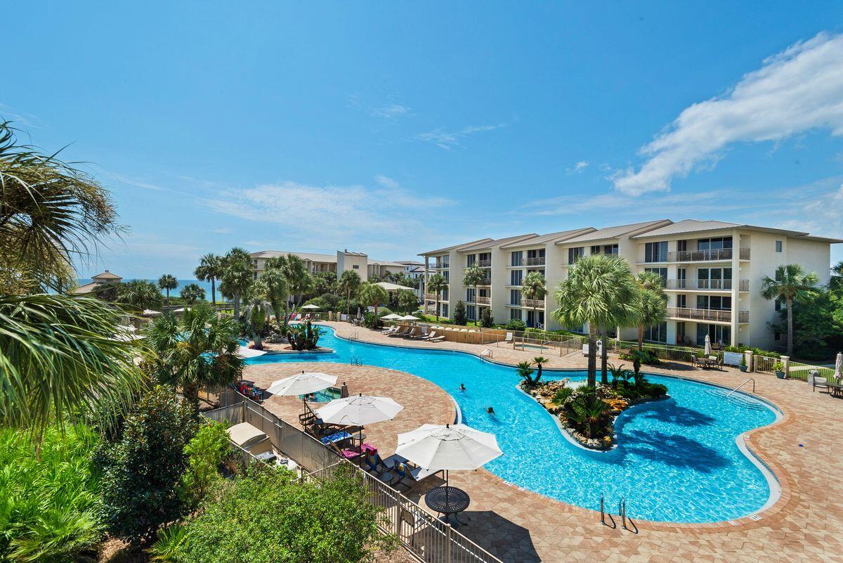 10254 East County Road, Unit 315 Inlet Beach, FL 32461 - Photo 2 of 37 a swimming pool with outdoor seating and yard