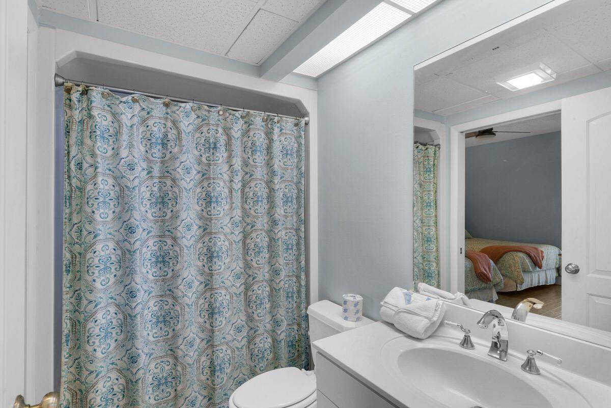 10254 East County Road, Unit 315 Inlet Beach, FL 32461 - Photo 29 of 37 a bathroom with a sink and a mirror