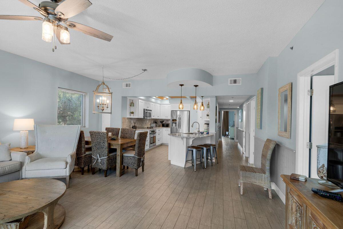 10254 East County Road, Unit 315 Inlet Beach, FL 32461 - Photo 10 of 37 a living room with furniture a dining table and a fireplace