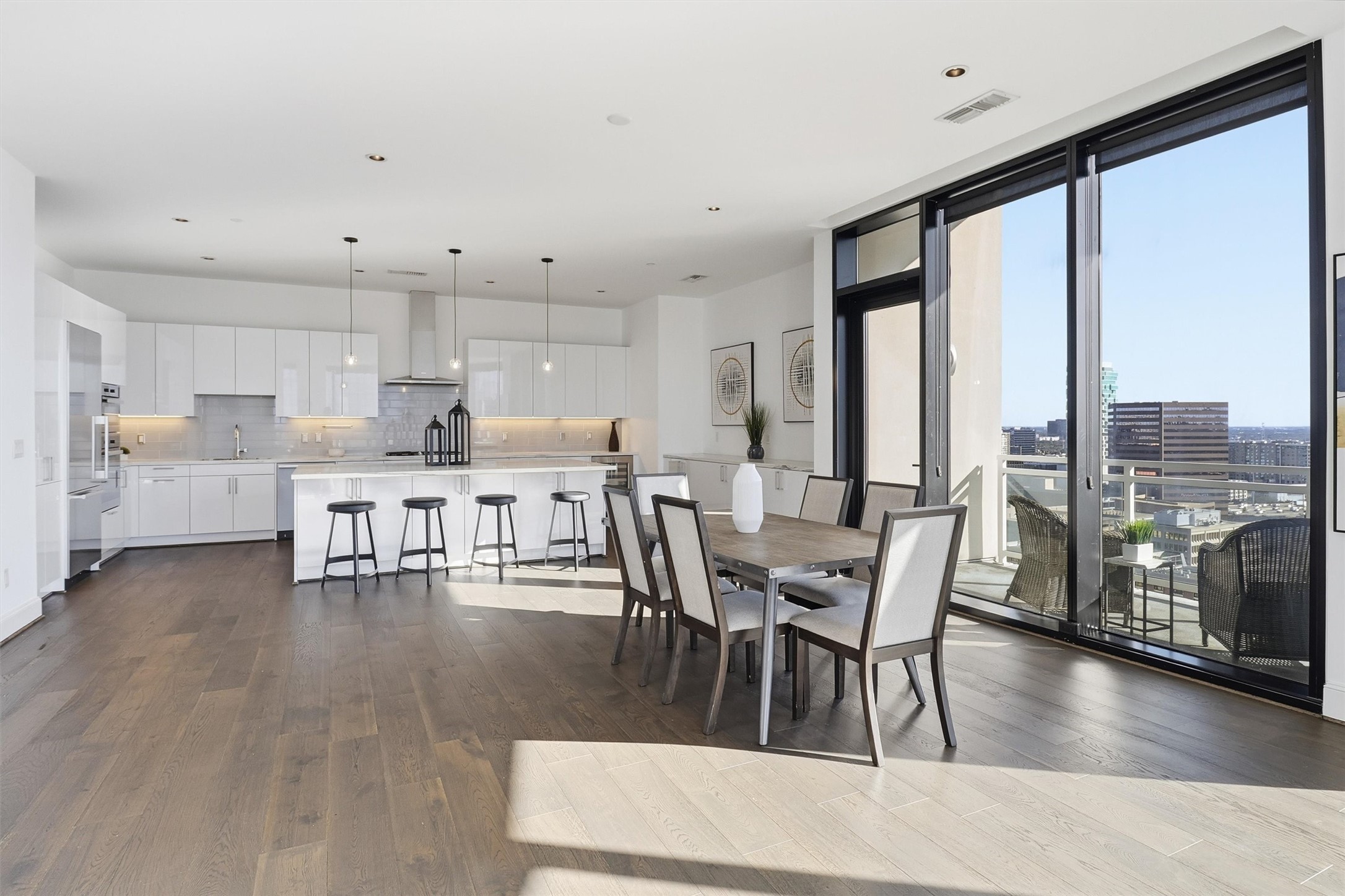 1409 Post Oak Boulevard, Unit 2004 Houston, TX 77056 - Photo 19 of 49 a dining room with furniture and wooden floor