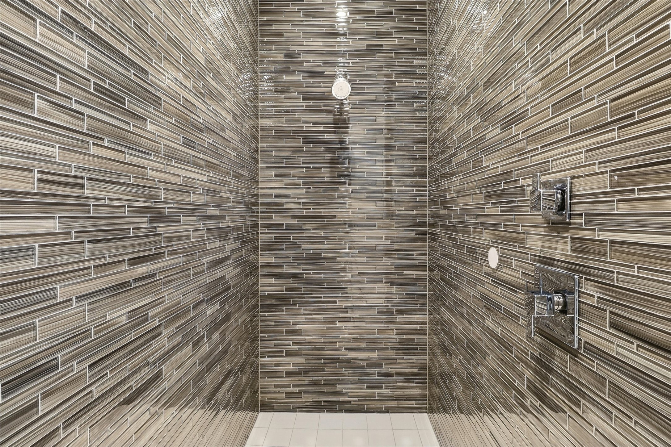 1409 Post Oak Boulevard, Unit 2004 Houston, TX 77056 - Photo 32 of 49 a bathroom with a wooden floor