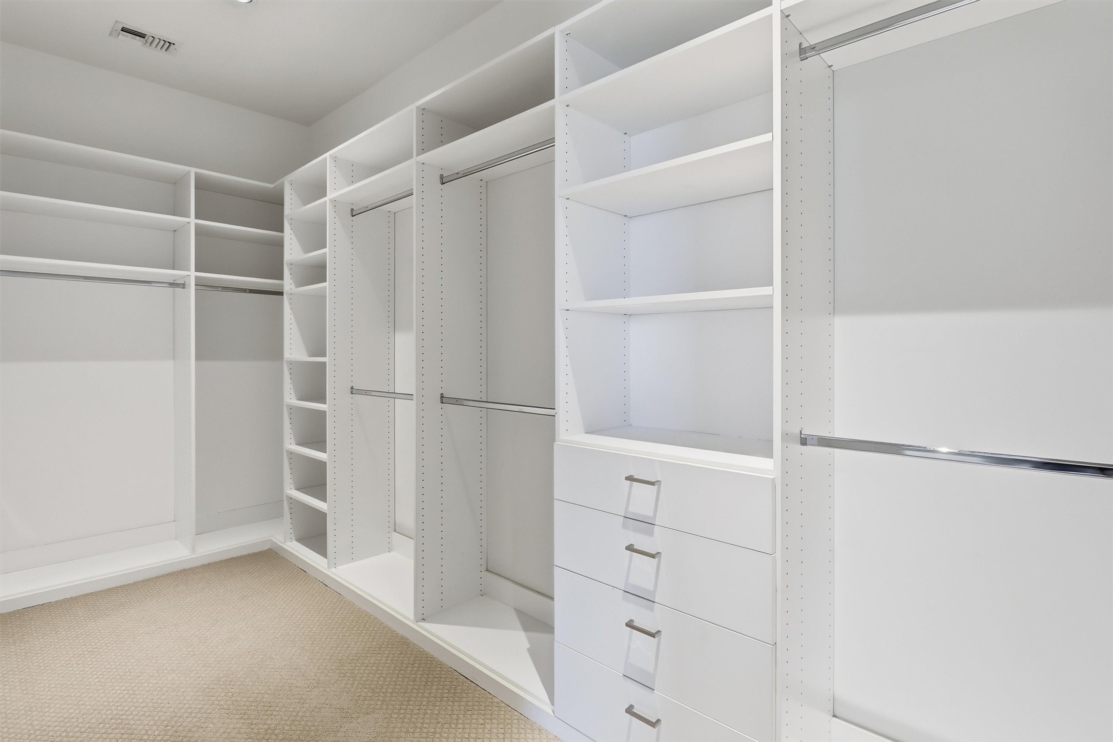 1409 Post Oak Boulevard, Unit 2004 Houston, TX 77056 - Photo 34 of 49 a view of walk in closet with empty racks