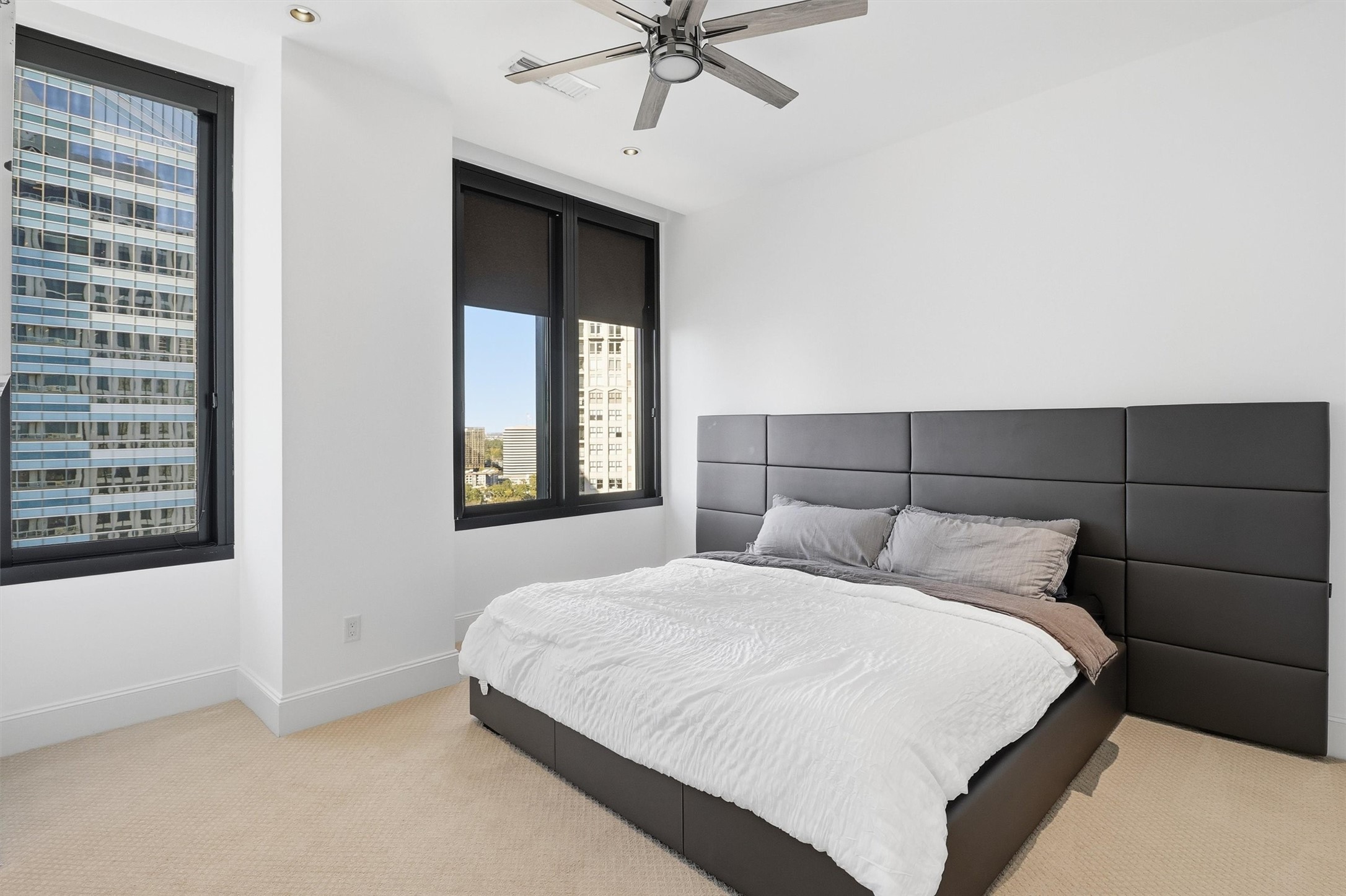 1409 Post Oak Boulevard, Unit 2004 Houston, TX 77056 - Photo 36 of 49 a bedroom with a bed and a window