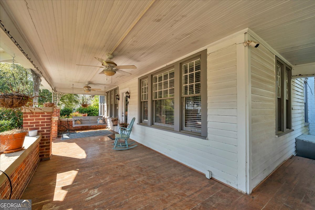 220 West Drive Dublin, GA 31021 - Photo 11 of 44 a view of a porch with a table and chairs
