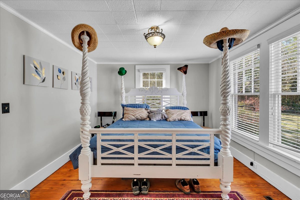 220 West Drive Dublin, GA 31021 - Photo 25 of 44 a living room with a bed furniture and a window