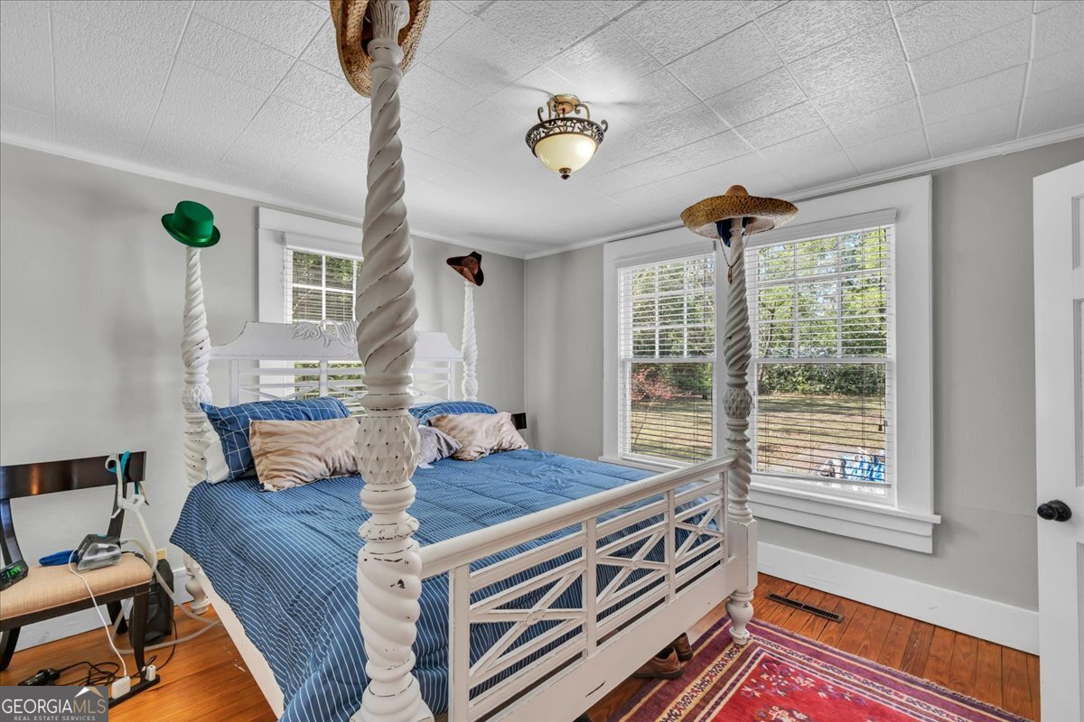 220 West Drive Dublin, GA 31021 - Photo 27 of 44 a bed room with a bed and a window