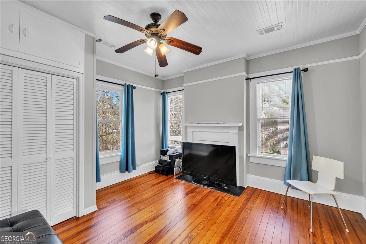 220 West Drive Dublin, GA 31021 - Photo 29 of 44 a view of empty room with wooden floor and fireplace