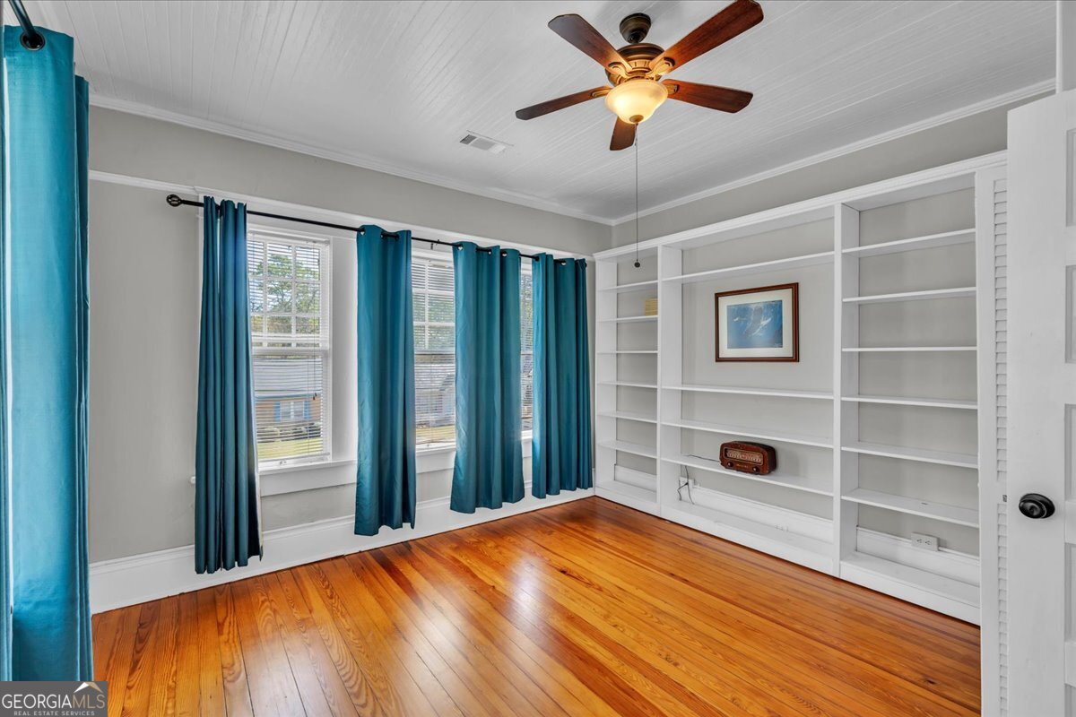 220 West Drive Dublin, GA 31021 - Photo 36 of 44 a bedroom with a bed and a window