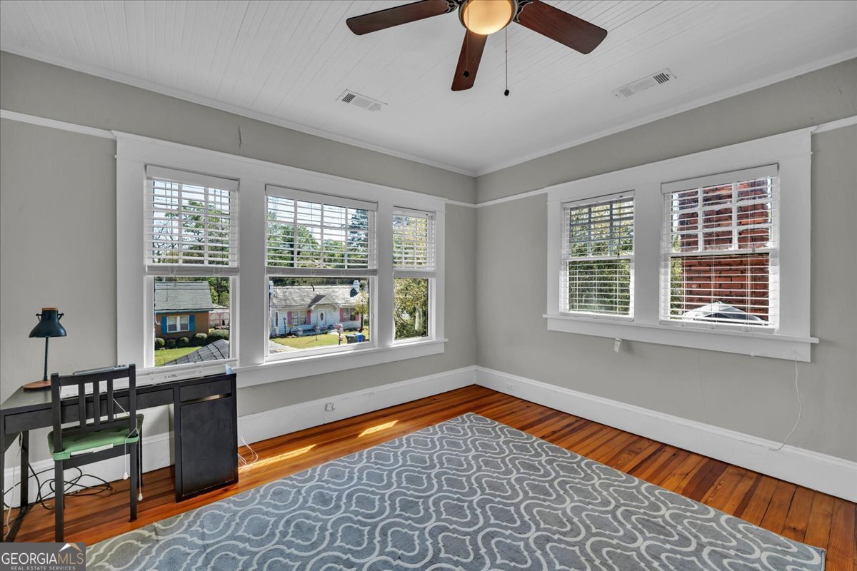 220 West Drive Dublin, GA 31021 - Photo 37 of 44 a view of an empty room with a window and kitchen area