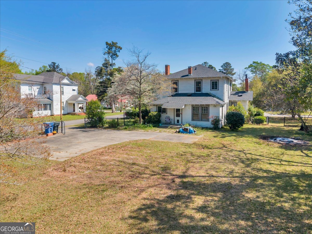 220 West Drive Dublin, GA 31021 - Photo 5 of 44 a front view of a house with a yard