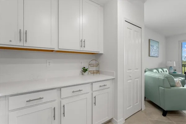 a bedroom with a bed and a ceiling fan