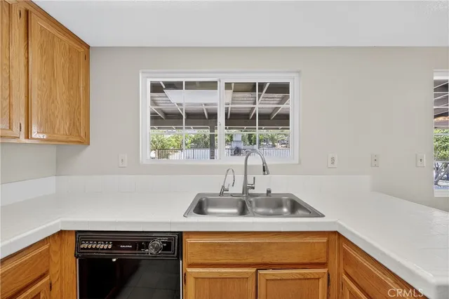a kitchen with a sink and a window