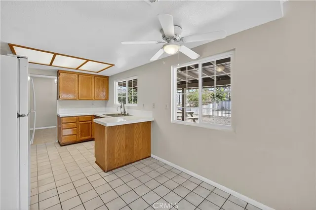 a spacious bathroom with a double vanity sink a mirror and a bathtub