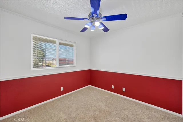 a room with window and ceiling fan