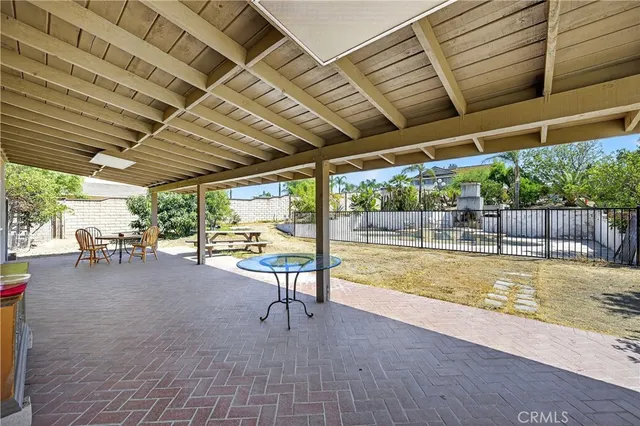 a view of a swimming pool with a patio