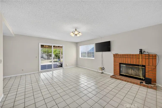 a view of livingroom with furniture flat screen tv and window