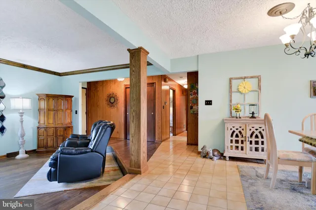 a view of living room filled with furniture and rug