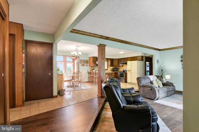 a living room with furniture and large windows