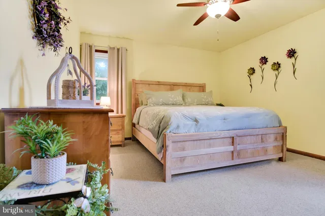 a bedroom with a bed and a table