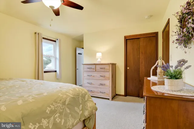 a bedroom with a bed and furniture