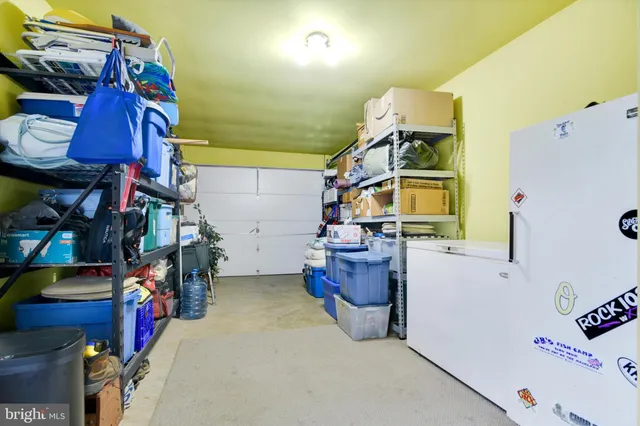 a front view of house with a garden