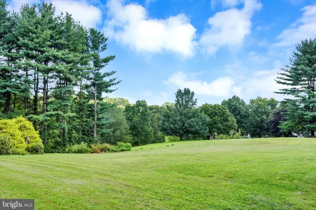 a view of a house with a big yard