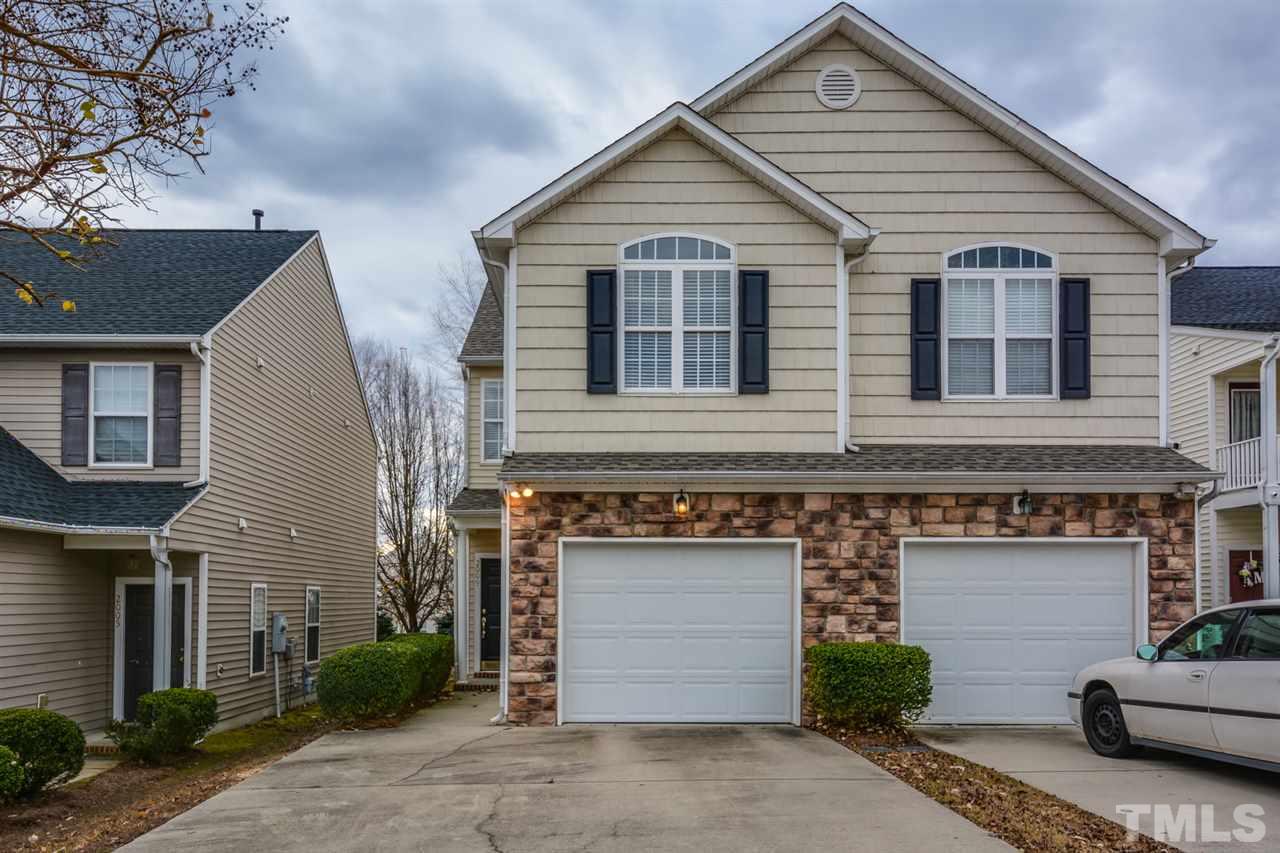 2009 Metacomet Way Raleigh, NC 27604 - Photo 1 of 15 a view of a white house next to a yard