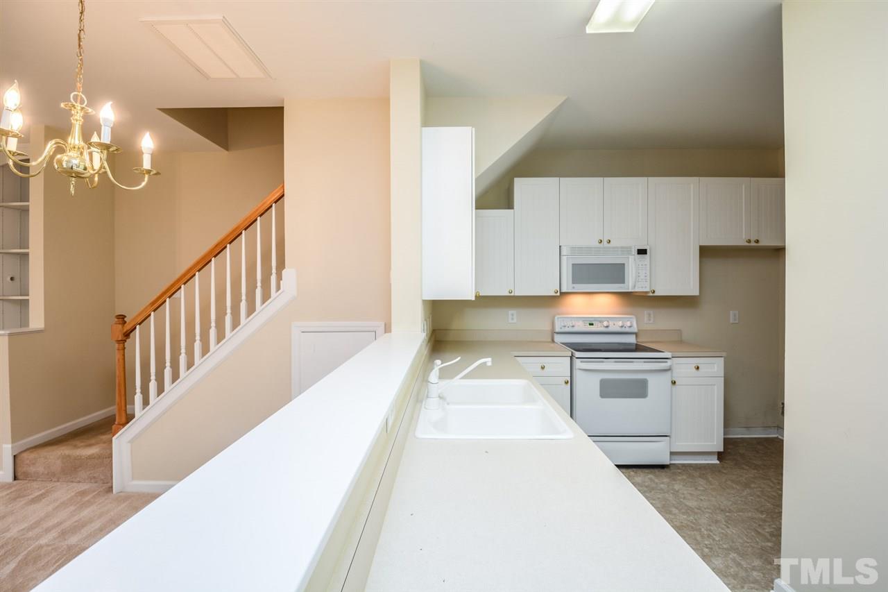 2009 Metacomet Way Raleigh, NC 27604 - Photo 2 of 15 a kitchen with stainless steel appliances a stove top oven and cabinets