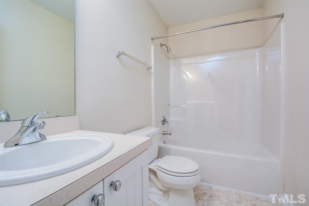 2009 Metacomet Way Raleigh, NC 27604 - Photo 11 of 15 a bathroom with a sink a toilet and a bathtub