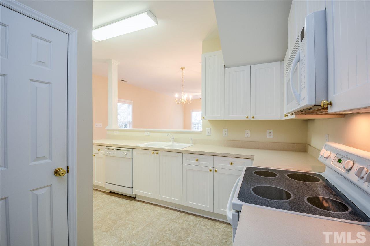 2009 Metacomet Way Raleigh, NC 27604 - Photo 5 of 15 a kitchen with a sink a stove and cabinets