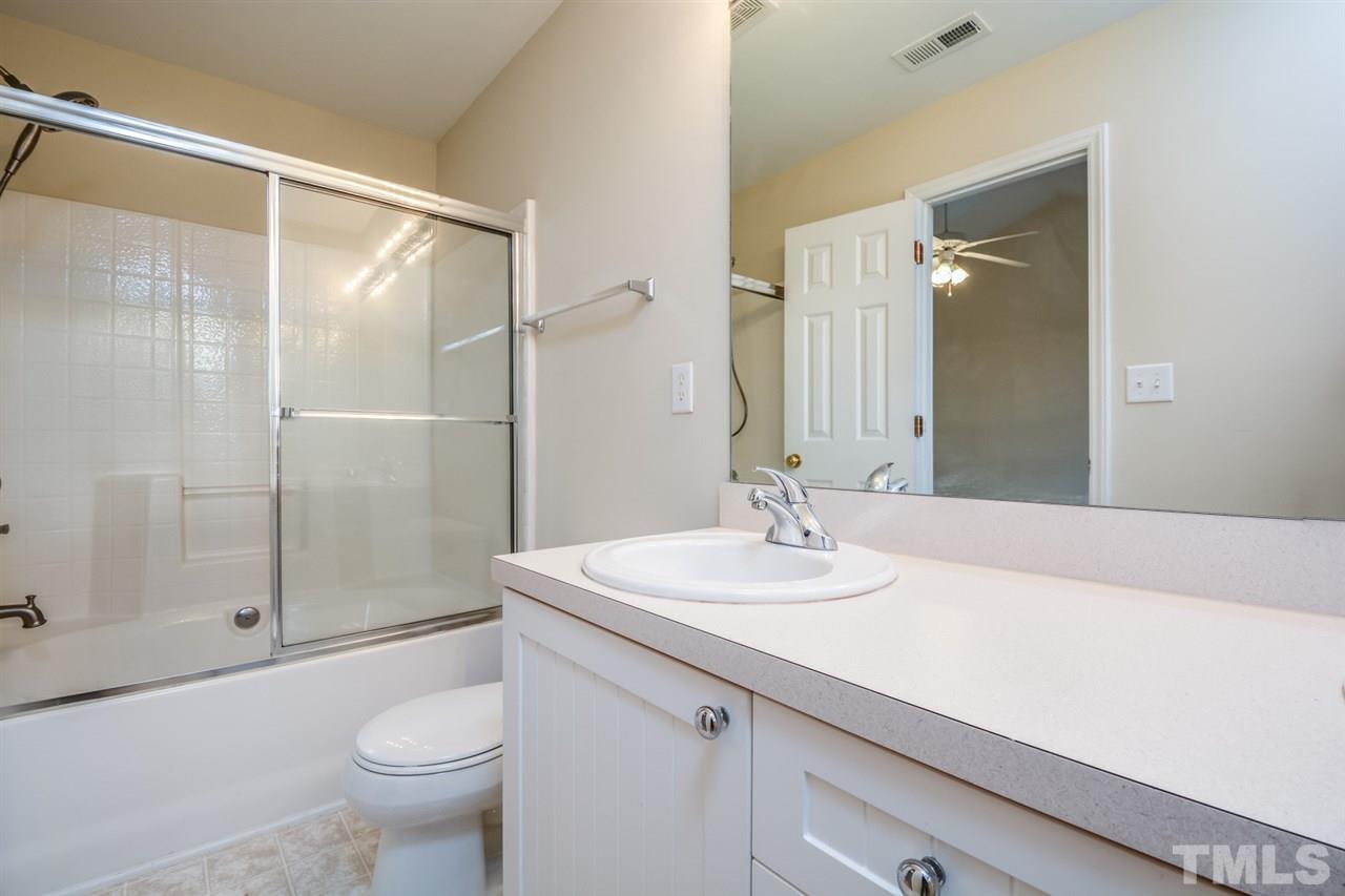 2009 Metacomet Way Raleigh, NC 27604 - Photo 7 of 15 a bathroom with a sink and a mirror