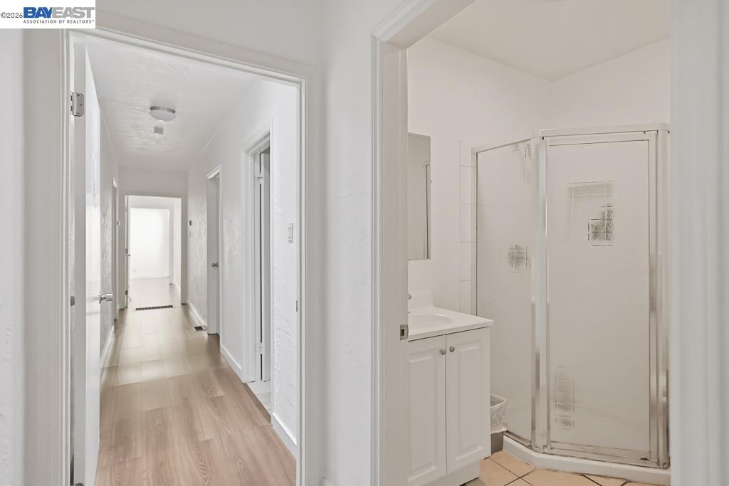 179 Los Ranchitos Road San Rafael, CA 94903 - Photo 11 of 38 a view of a hallway with wooden floor and closet area