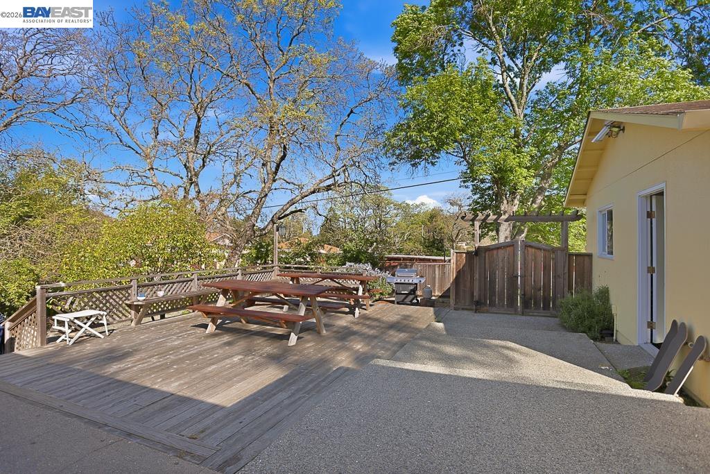 179 Los Ranchitos Road San Rafael, CA 94903 - Photo 24 of 38 a view of backyard with table and chairs and potted plants