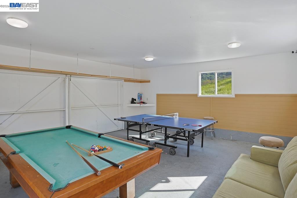 179 Los Ranchitos Road San Rafael, CA 94903 - Photo 26 of 38 a living room with furniture pool table and a window