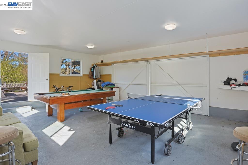 179 Los Ranchitos Road San Rafael, CA 94903 - Photo 27 of 38 a living room with pool table and a couch