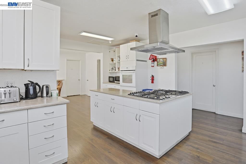 179 Los Ranchitos Road San Rafael, CA 94903 - Photo 5 of 38 a kitchen with stainless steel appliances granite countertop a stove and a sink