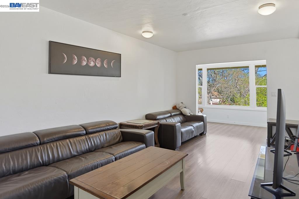 179 Los Ranchitos Road San Rafael, CA 94903 - Photo 6 of 38 a living room with furniture and a flat screen tv