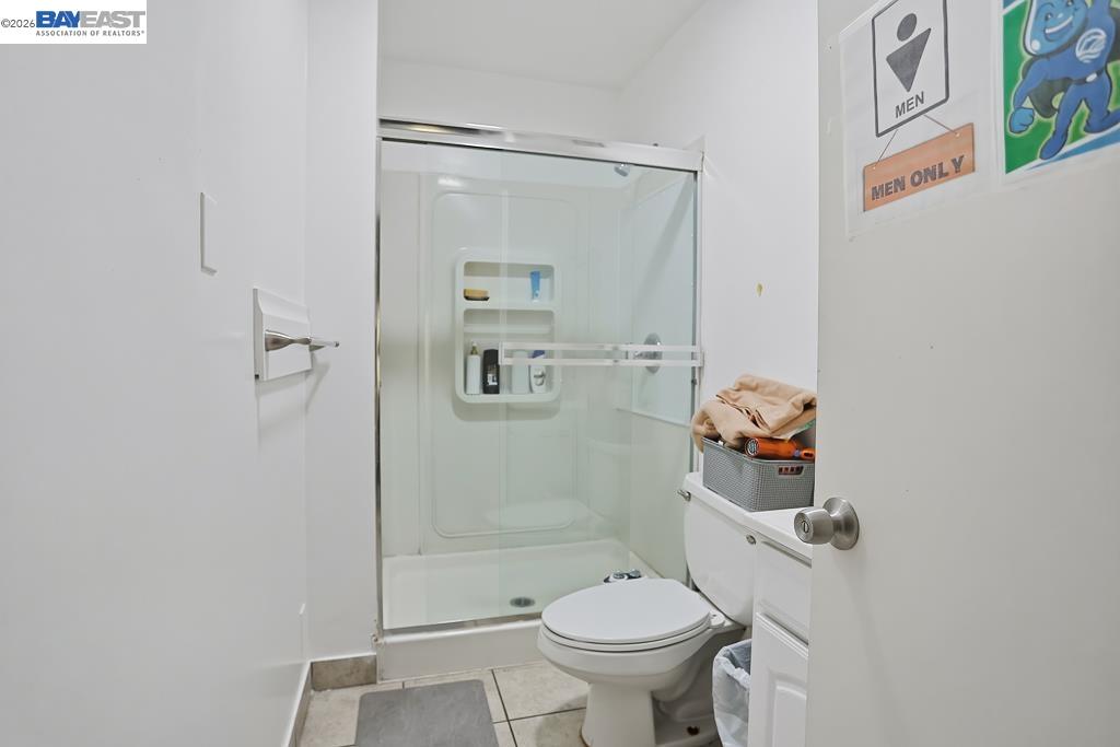 179 Los Ranchitos Road San Rafael, CA 94903 - Photo 9 of 38 a bathroom with a shower and toilet