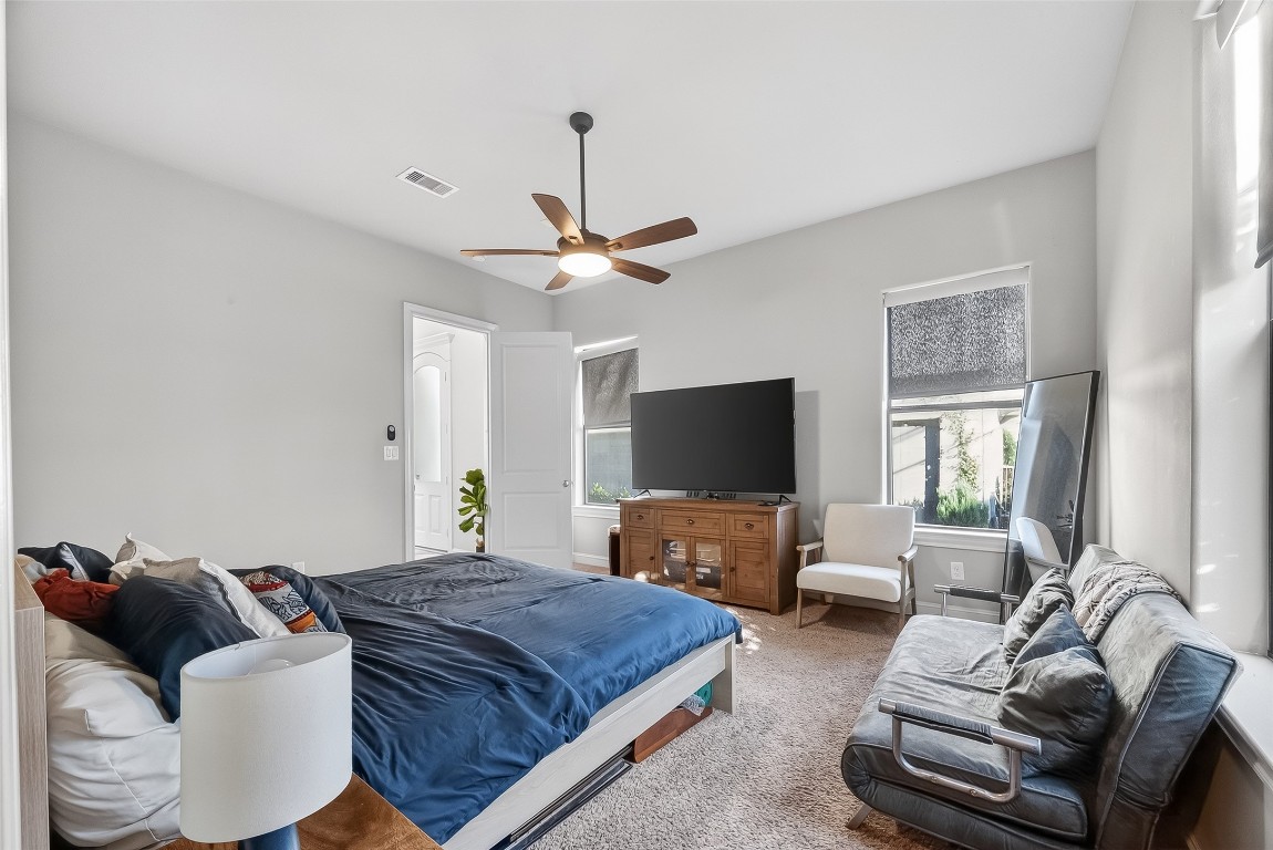 605 Meadow Street Houston, TX 77020 - Photo 15 of 31 a bedroom with a bed and a couch